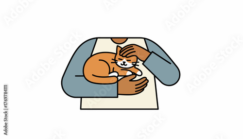 A cat being gently held in a caretakers arms while the owner strokes its head affectionately.