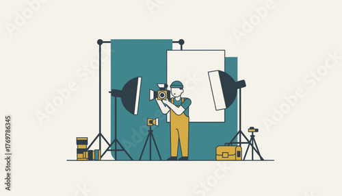 Cameraman operating a professional video camera under softbox lights on a studio set, filming against a backdrop for video production, streaming or cinematic content creation