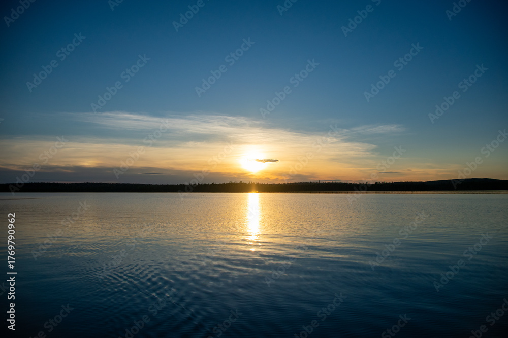 Naklejka premium Sun reflecting off the lake nearing sunset Ontario Canada