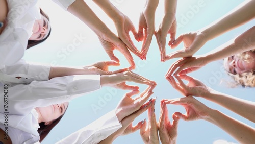 A beautifully creative arrangement of various hands forming heart shapes, symbolizing unity and teamwork