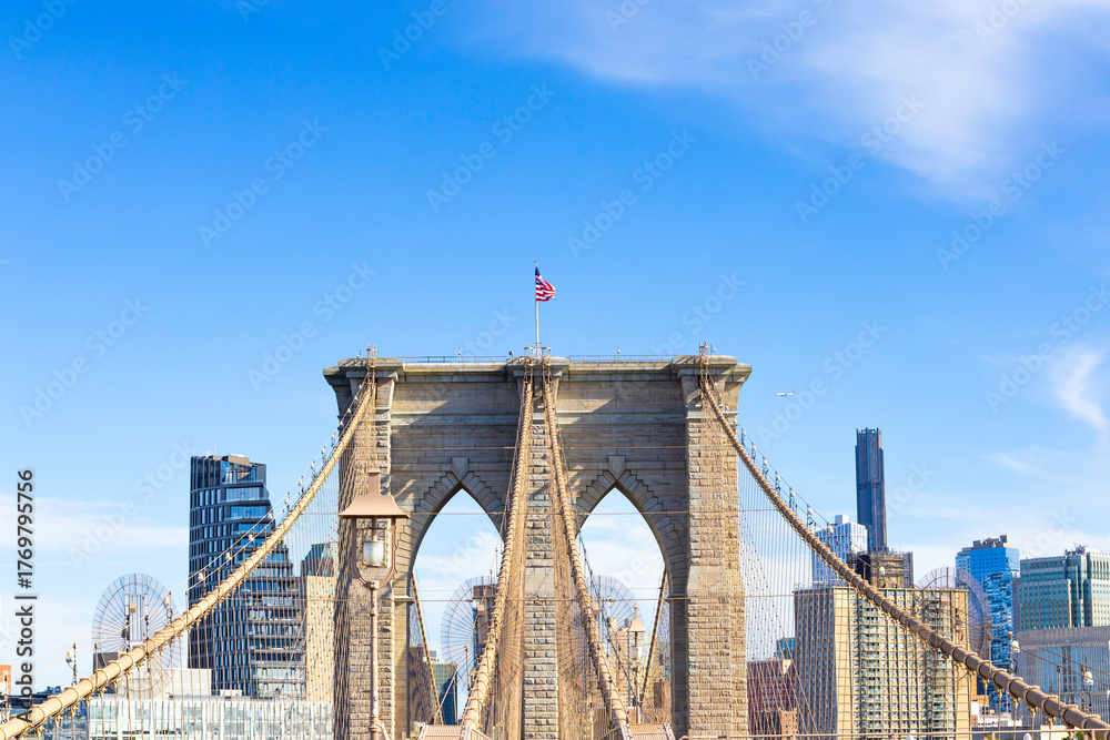 Fototapeta premium The pedestrian section of the Brooklyn Bridge in New York City is empty of people during the day.