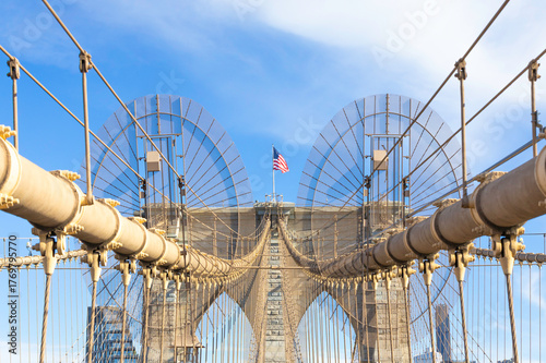The pedestrian section of the Brooklyn Bridge in New York City is empty of people during the day.