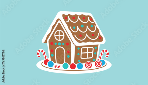 An intricate gingerbread house displayed on a festive table complete with colorful icing decorations surrounded by candy.