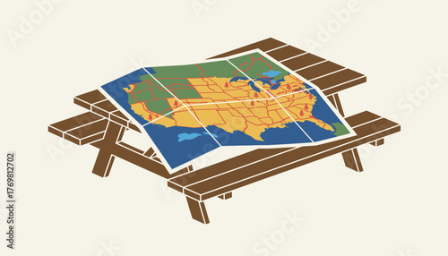 A traditional road map unfolded on a picnic table featuring colorful state lines and scenic routes clearly marked for exploration.