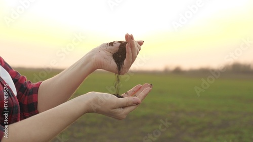 The agronomist checks the nutritional value of the soil of the land, fertilized and plowed field, the farmer works in the open air, the life of a collective farmer in the countryside, 4K.