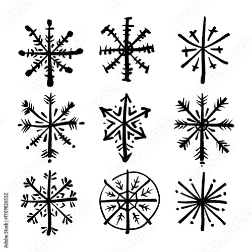 Set of New Year brush stroke or chalk ornate texture snowflakes icons, Christmas patterned black brush hand-drawn isolated elements on white background. Scandinavian Norwegian simple winter print