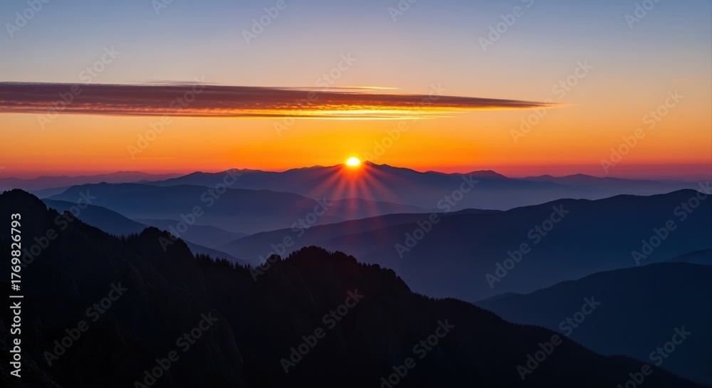 Fototapeta premium breathtaking mountain sunrise casting colorful light over misty horizon and peaks