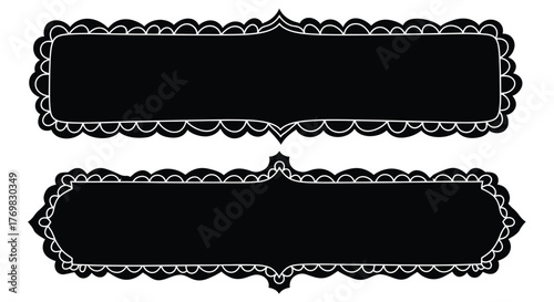 Two ornate black frames with decorative white scalloped borders displayed