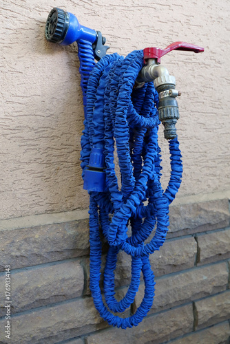 Outdoor tap for watering a garden plot. Water tap outside the building