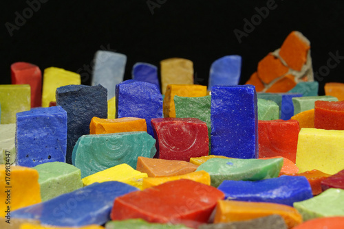 Multi-colored smalt from Soviet mosaics on black background