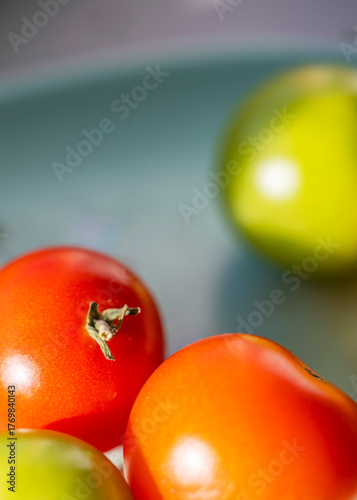 Home grown tomatoes,ripening in the Autumn sun,Worcester,United Kingdom.