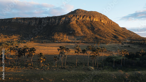 Morro da Baleia, Chapada dos Veadeiros, aerial drone view, green fields with buritis, mountains, road