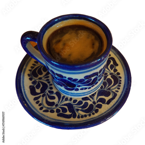 single shot of espresso in a hand painted Talavera demitasse cup and saucer showing crema - extracted from photo for use in illustrations 