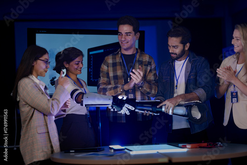 Photos successful startup team poses with their innovative product
