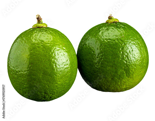 Two bright green, smooth-skinned citrus fruits with stems are set against a dark, pure black background