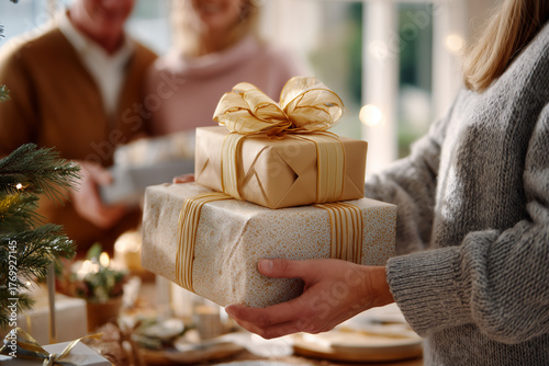 Diverse Family and Friends Exchanging Christmas Presents at a Festive Holiday Gathering
