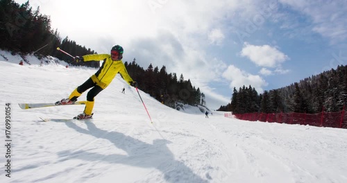 Enjoying smooth skiing on powdery slopes in beautiful winter mountains with fellow skiers amidst stunning scenery