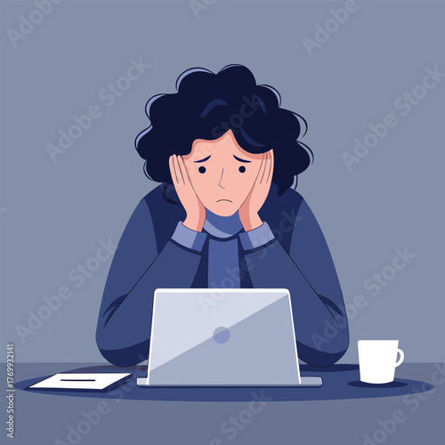 A stressed woman sits at her desk with a laptop, conveying the feeling of burnout and the challenges of work