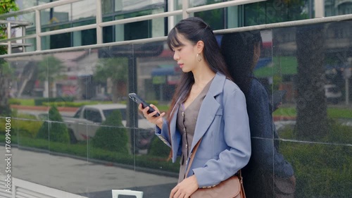 Young happy business businesswoman modern office travel outdoor walking, checking smart watch for urban schedule, managing busy day, elegant professional female.