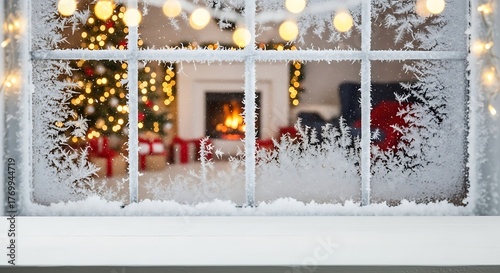 Christmas window with frost and view of decorated living room with fireplace