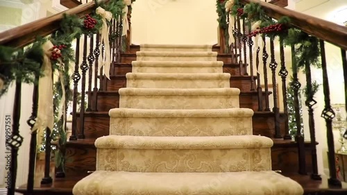 Elegant staircase adorned with festive christmas decorations and holiday cheer indoors