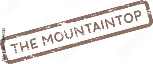 Grungy textured rubber stamp impression featuring the inspiring phrase The Mountaintop for aspirations and achievement