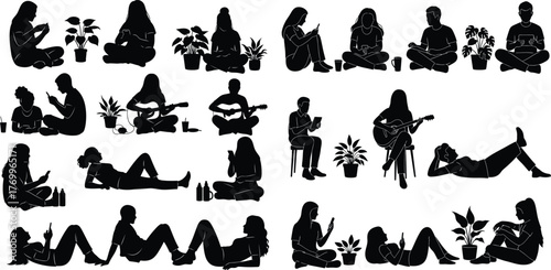 Diverse group of young men and women spending leisure time sitting or lying down while using phones, playing guitar, and enjoying potted plants at home