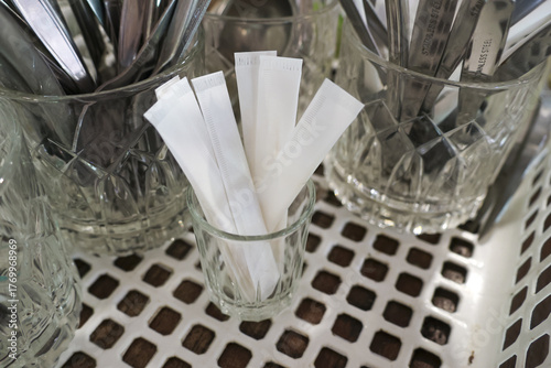 Bild auf Leinwand White paper blotter strip in glass cup for perfume scent test