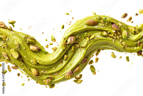 Swirl of pistachio cream topped with nuts against a black background