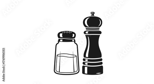 A classic salt shaker and a pepper mill, common kitchen and dining accessories used for seasoning food.