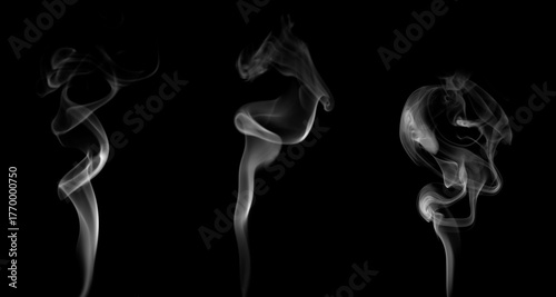 Photos Set of abstract white smoke shapes rising on black background, creating soft swirl motion
