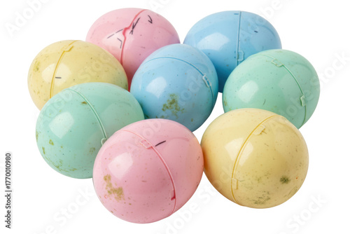 Pile of dirty old vintage pastel colored plastic toy capsules isolated on a transparent background
