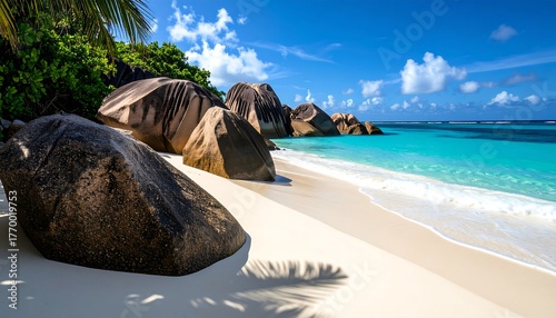 Fototapeta Naklejka Na Ścianę i Meble -  Pristine Seychelles Beach Giant Granite Rocks with Turquoise Water, Sunny Sky, and Paradise.