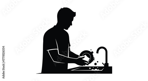 Man washing dishes at a kitchen sink with running water in a striking black and white silhouette