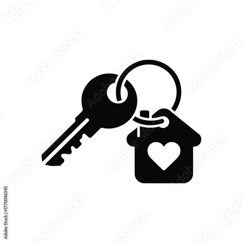 House key with heart keychain symbolizing home ownership and love