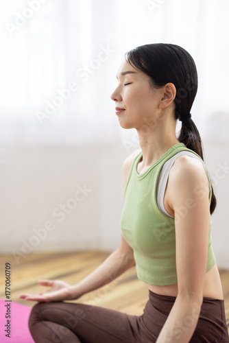 Free Download Close-Up Portrait of Japanese Woman Meditating Indoors in Natural Light - GFXLoad
