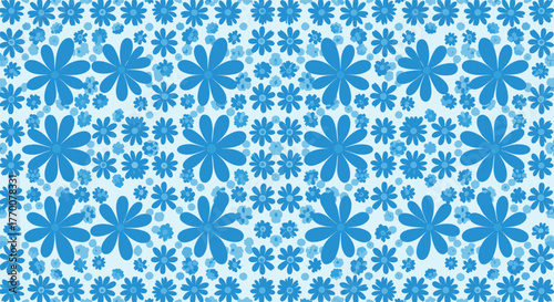 An eye-catching repeating pattern of various blue flowers scattered across a pale blue background, creating a whimsical and decorative design.