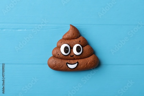 poop emoticon on blue background