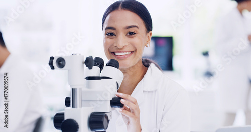 Photos Portrait, scientist and happy woman with microscope, research and medical development