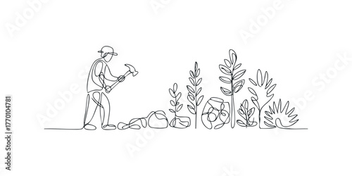 Gardener planting in garden with tools and plants