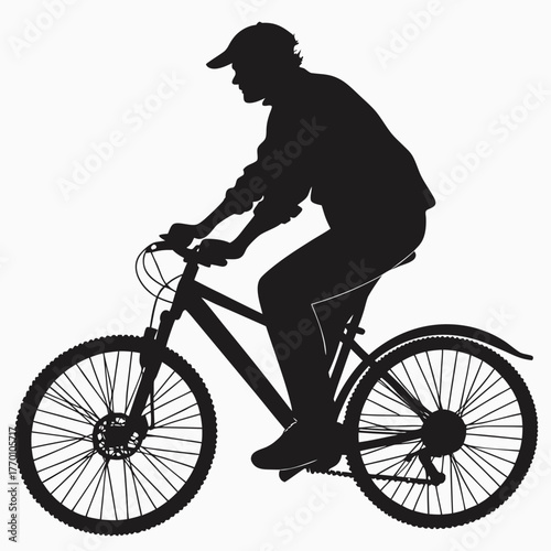Silhouette of a man riding a bicycle