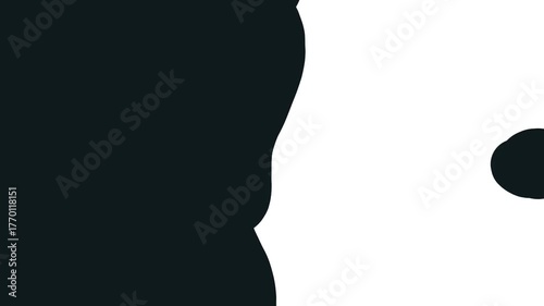 A drop emerges from the black lateral mass and flies off to the right.