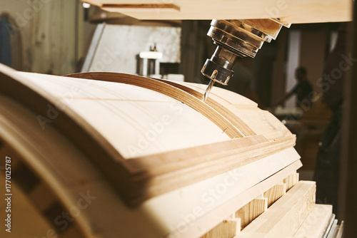 Machine with computer numerical control for cutting wood with various router bits.