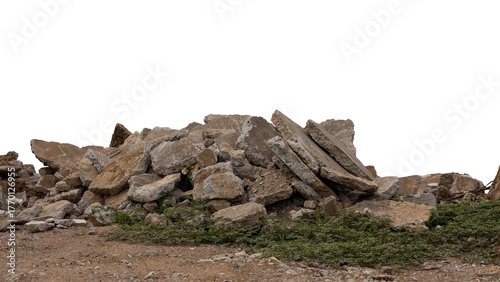 Close-up low angle view isolate of concrete debris, removed from road demolition and dumped on the ground, commonly seen in rural Thai road construction.