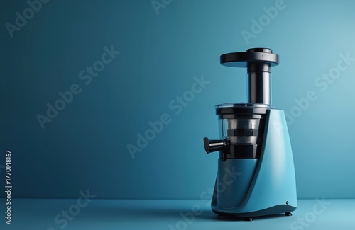 Wallpaper Mural Modern electric juicer on plain blue background with copy space. Kitchen appliance for making fresh fruit vegetable juice. Healthy lifestyle equipment for detox, vitality, vegetarian diet. Isolated Torontodigital.ca