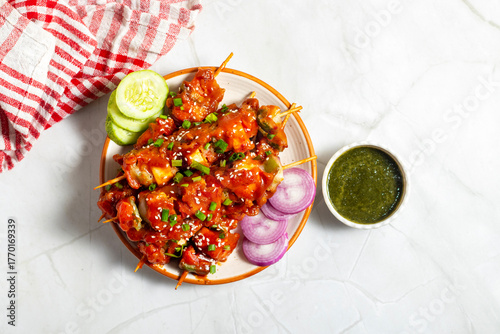 Paneer satay is a grilled Indian appetizer made with marinated paneer cubes, skewered, and served with spicy peanut or yogurt dip.
