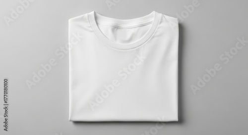 Folded White T Shirt on Light Background - A neatly folded white t-shirt, showcasing simplicity, cleanliness, minimalism, comfort, and essential