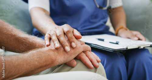 Clipboard, healthcare and nurse holding hands with old person in clinic for consulting or support. Empathy, rehabilitation or retirement with caregiver and senior patient in session for medical care
