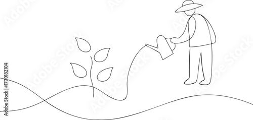 Person in hat watering a plant with a watering can