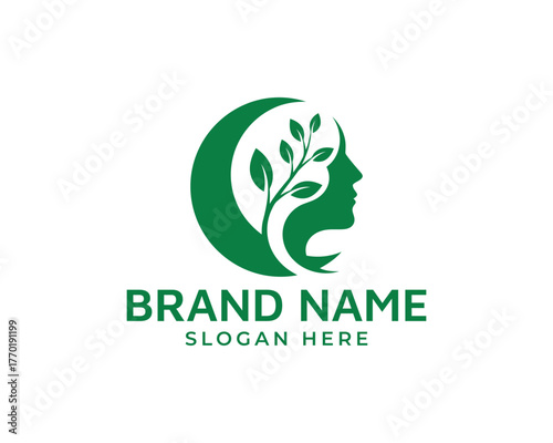 Green silhouette of a womans profile with a plant growing inside isolated on white background